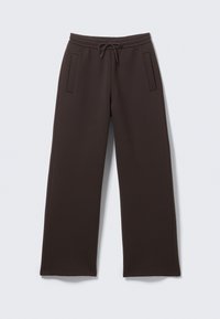 Bruine joggingbroek van zacht materiaal, met een trekkoord in de taille, twee zijzakken en een losse, rechte pijpdesign.