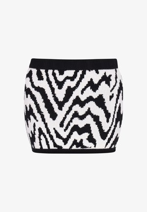 Falda de punto en blanco y negro con un patrón en zigzag, de diseño ajustado y con una cinturilla acanalada que proporciona estructura y soporte.