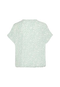 Blusa verde chiaro con una vestibilità ampia, maniche corte e un motivo floreale bianco su tutta la superficie. Collo semplice e tessuto morbido e testurizzato.