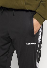 Pegador Träningsbyxor - black