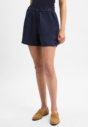 Navy cotton shorts with a gathered waistband, side pockets, and a relaxed fit. The fabric has a textured finish and a casual design.