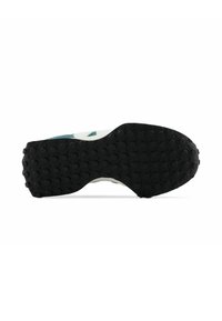 Black rubber outsole with textured grip pattern, featuring white and teal accents. Curved shape designed for comfort and stability.