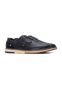 Zapatos de cuero negro con un acabado suave, acentos de ante azul marino contrastantes, suela beige y costuras decorativas. Cuentan con un diseño de cordones y un logo.