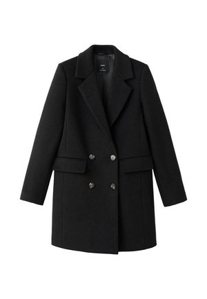 Czarny płaszcz z mieszanki wełny z dwurzędowym zapięciem, wyciętym kołnierzem, dwoma bocznymi kieszeniami i metalowymi guzikami. Zachowuje wyraźnie zarysowaną sylwetkę.