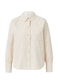 Camicia beige con bottoni, colletto classico, maniche lunghe con polsini arricciati e una tasca sul petto. Realizzata in tessuto strutturato.