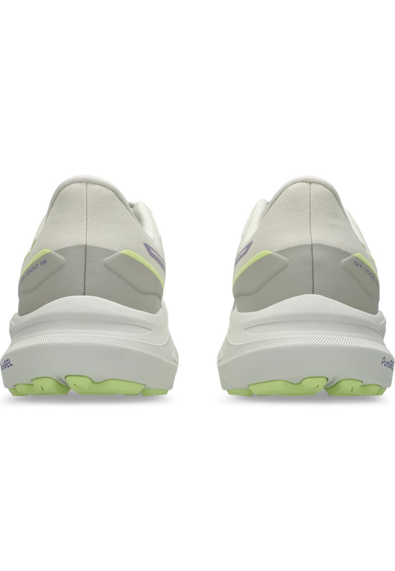 Witte hardloopschoenen met een gestructureerde bovenkant, lichtgrijze accenten en groene buitenzolen. Voorzien van een gevoerde kraag en gevoerde zolen voor extra comfort.