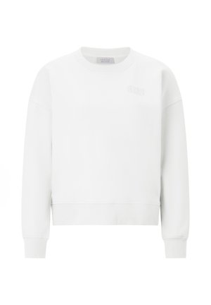 Valge dressipluus ümmarguse kaelusega, soonikkoes mansettide ja äärega. Esiküljel on peen logo samas toonis. Pehme kangatekstuur.