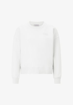 Balta džemperis su apvalia apykakle, ribinėmis rankogaliais ir apačia. Priekyje yra diskretiškas to paties atspalvio logotipas. Minkšta audinio tekstūra.