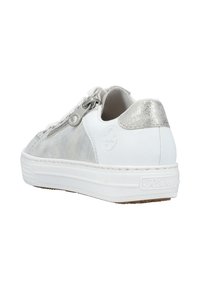 White sneaker with textured gray accents, silver heel cap, and a side zipper. Rubber sole with patterned tread for traction.