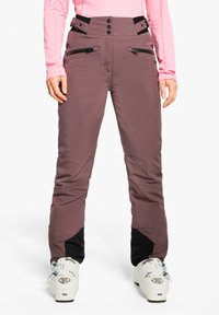 Skihose in dunklem Mauve mit glatter Textur, hoher Taille und kontrastierenden schwarzen unteren Einsätzen. Mit Reißverschlüssen und Knopfverschlüssen vorne.