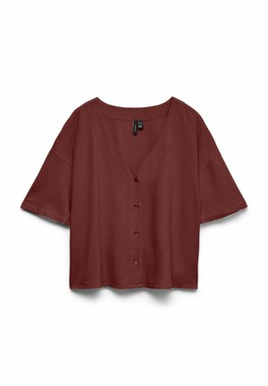 Lühikeste varrukatega, nööbitav, lahtise istuvusega pluus tumedat punakaspruuni värvi, V-kaelusega ja lastud õmblustega õlgadel.