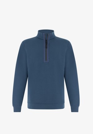 Sininen puolivetoketjullinen collegepaita korkealla kauluksella, pitkät hihat ja resorireunukset. Sileä pinta, jossa on vähän saumoja ja vetoketjullinen taskudetaili.