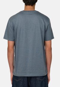 Blue cotton t-shirt with a round neckline and short sleeves, featuring a smooth texture and a relaxed fit.