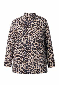 Bluzka w panterkę z wysokim kołnierzem, długimi rękawami i miękkiego materiału. Posiada beżowe tło z ciemnobrązowymi i czarnymi cętkami.
