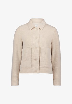Beige strukturierte Jacke aus gewebtem Stoff. Verfügt über einen Kragen, eine vordere Knopfverschluss, zwei große aufgesetzte Taschen und lange Ärmel.