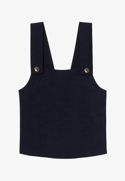 Débardeur sans manches bleu marine avec larges bretelles, mettant en avant des boutons-pression argentés et un tissu texturé. Ourlet droit avec un design minimaliste.