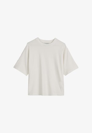 Balta medvilninė marškinėliai su apvaliu kaklu, trumpomis rankovėmis ir laisvu siluetu. Lygi tekstūra ir paprastas dizainas, be matomų raštų ar akcentų.