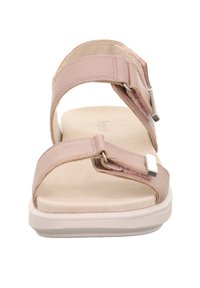 Helle rosa Sandalen aus weichem synthetischem Material, mit zwei verstellbaren Riemen und einer gepolsterten Innensohle, ausgestattet mit einer weißen Gummisohle.