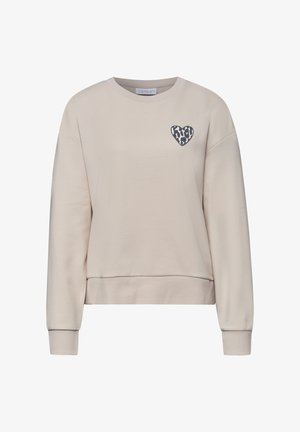 Beiger Langarm-Sweatshirt mit gerippten Bündchen und Saum, mit einem kleinen schwarz-weißen Leopardenherz auf der linken Brust.