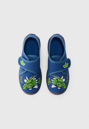 Blue slip-on shoes with a green dragon graphic on the toe, fabric upper, adjustable strap, and textured rubber sole.