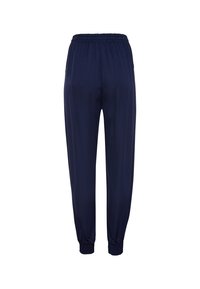 Marineblaue Hose mit elastischem Bund und lockerer Passform. Verfügt über schmal zulaufende Bündchen und einen glatten, leichten Stoff. Einfaches, minimalistisches Design.