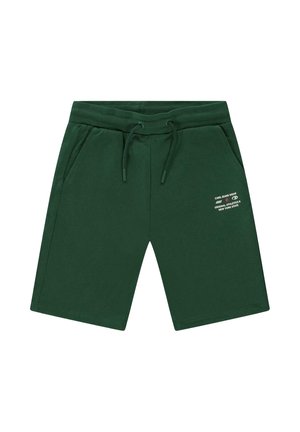 Donkergroene korte broek tot op de knieën met elastische tailleband en trekkoord, voorzakken en witte bedrukte tekst op de rechterdij.