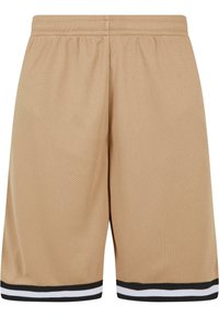 Shorts en mesh beige avec une taille élastique, ornés d'accents rayés noirs et blancs à l'ourlet. Tissu léger et respirant.