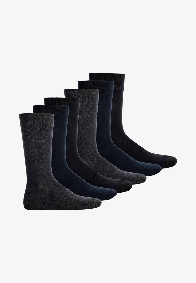 Seis pares de calcetines en varias tonalidades de gris oscuro y negro, con un diseño texturizado y puños de canalé. La tela parece suave y duradera.