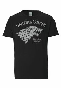 Black cotton t-shirt featuring a gray wolf graphic with "Winter Is Coming" text and "Game of Thrones" logo beneath. Short sleeves, crew neck.