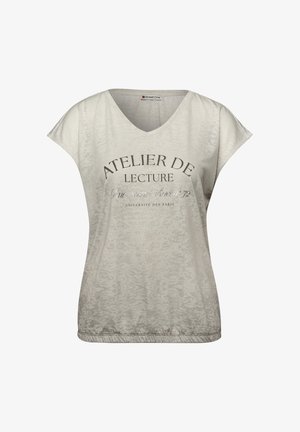 Jasnobeżowa koszula z krótkim rękawem i dekoltem w serek, z francuskim napisem „Atelier de Lecture, Université des Paris” nadrukowanym z przodu.