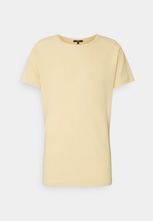 T-shirt semplice giallo chiaro a maniche corte con collo rotondo, mostrata su uno sfondo piatto grigio chiaro.
