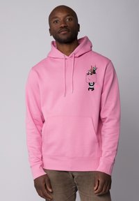 Roze hoodie met een voorzak, voorzien van een grafiek van panda's en eetstokjes. Gemaakt van zachte stof met verstelbare trekkoorden en geribde manchetten.
