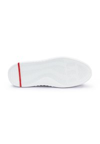 White rubber shoe sole with textured patterns and ridges; features a red accent stripe near the heel for added detail.