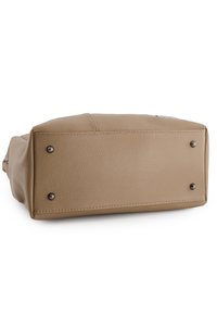Tan leather bag with a textured surface, rectangular shape, and metal studs on the bottom for stability. Stitched detail along the edges.