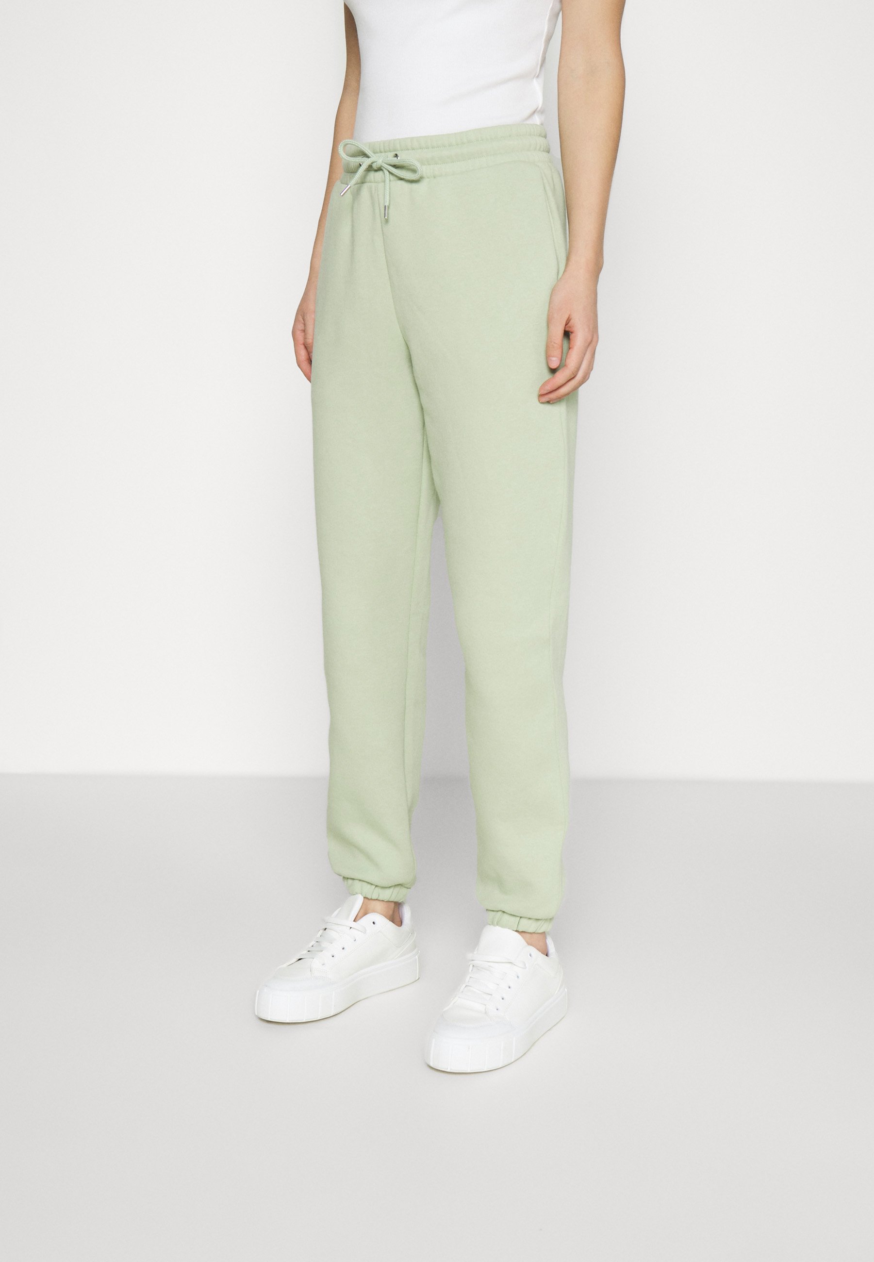 Monki Trainingsbroek - green dusty light/Groen - Zalando.nl