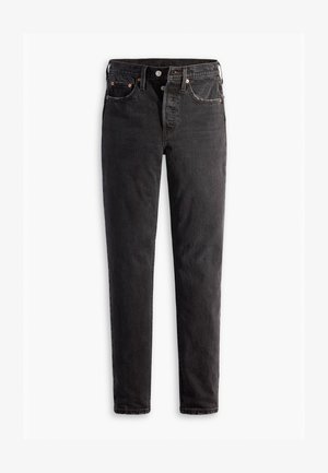 Jeans in denim nero con taglio dritto, dotati di cinque tasche, accessori in rame e una texture leggermente sbiadita.