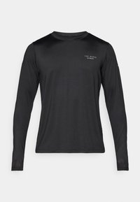 Black long-sleeve athletic shirt with a smooth, textured fabric. Features a round neckline and a small white logo on the chest.