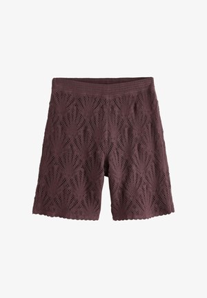 Háčkované tmavě hnědé krátké kalhoty s vysokým pasem a vroubkovanými lemy, zdobené vzorem připomínajícím listy po celém povrchu.