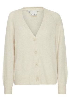 Beež kudumiga kardigan V-kaelusega, raglanvarrukatega ja nelja esiplaanil oleva nupuga. Pehme tekstuur ribitud varruka- ja alumise servaga.