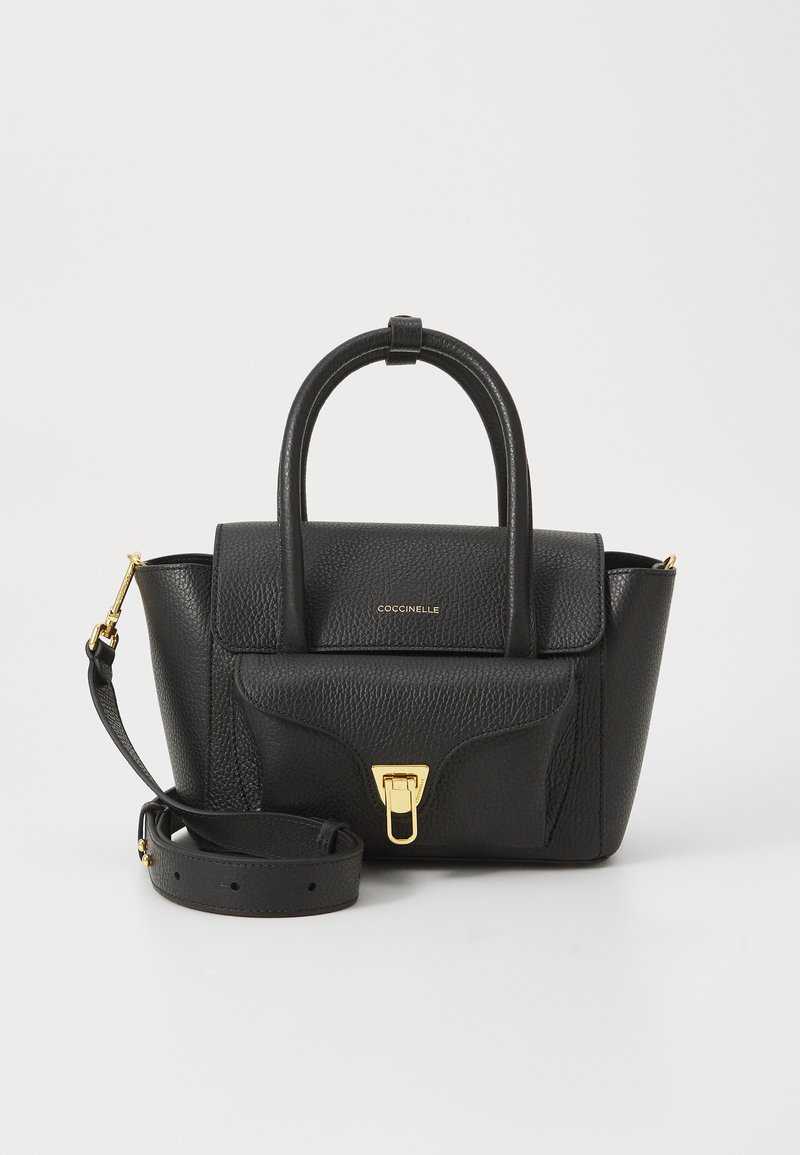 Black leather handbag with a textured finish, two top handles, a detachable strap, gold hardware, and a flap with a clasp closure.