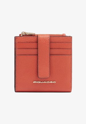 Compact brown leather wallet with six card slots, a central strap, a top zipper compartment, and gold "Piquadro" logo on front.