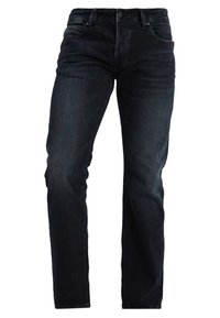 Jeansy z ciemnoniebieskiego denimu o prostym kroju nogawek. Posiadają pięć kieszeni oraz klasyczne zapięcie na guzik i zamek błyskawiczny. Wykończone lekkim blaknięciem i efektami przetarć.