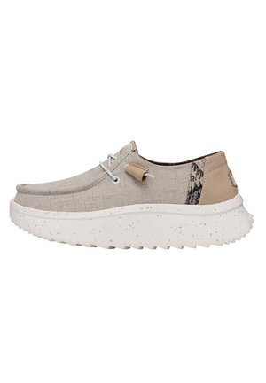 Grey fabric slip-on shoe with a textured finish, white speckled sole, and subtle patterns on the heel, featuring elastic laces and tag.