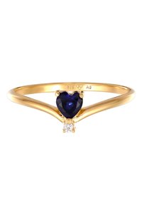Guldbelagt ring med en hjerteformet blå sten, ledsaget af en lille diamantaccent, på et glat, slankt bånd.