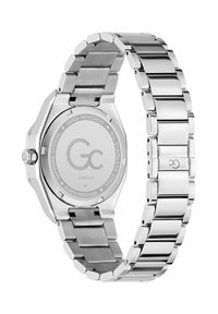 Roostevabast terasest kell, millel on kaheksanurkne korpus, lingitud metallkett ja siledal tagaküljel logo ning tehnilised andmed.