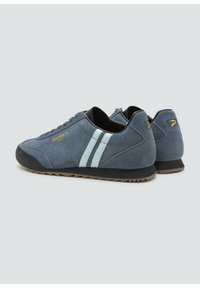 Blue suede sneakers with light blue stripes, black accents, and gold branding. Features a textured rubber sole with a zigzag pattern.