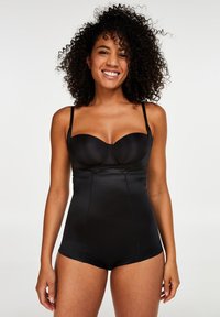 Černý body s kosticemi, nastavitelnými ramínky a přiléhavým střihem. Vyrobeno z hladkého, elastického materiálu se subtilními švy a elegantním povrchem.