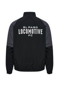 Svart vindjacka med grå detaljer, med "EL PASO LOCOMOTIVE FC" i fet vit text på baksidan och ett elastiskt midjeband.