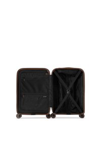 Black luggage with a hard shell, featuring a tan trim, interior mesh pockets, cross straps, and smooth wheels for easy mobility.