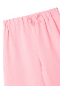 Pantaloni sportivi rosa chiaro con vita elasticizzata e cordino, realizzati in una texture morbida e liscia. Design con vestibilità rilassata.
